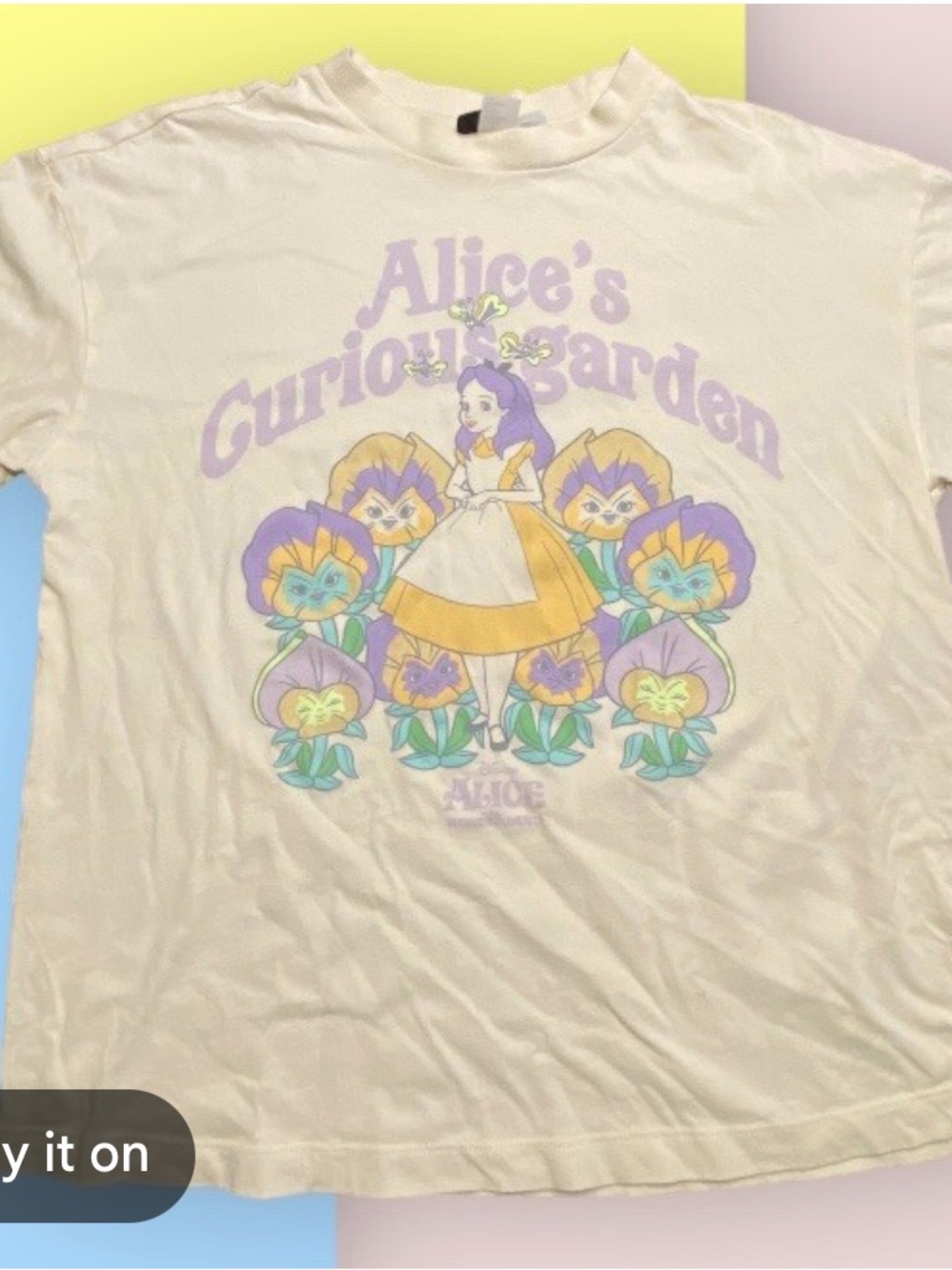 H&M 💜 Cream Tee with Purple & Yellow Alice  in wonderland Graphic